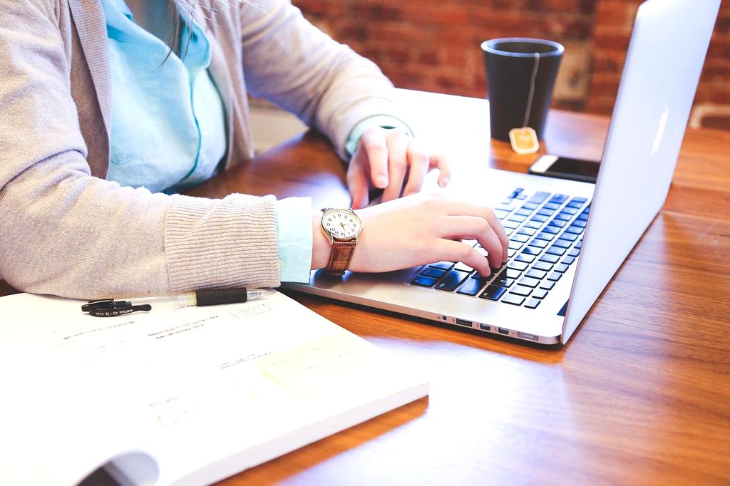Modern workspace showing pricing strategy on digital screens